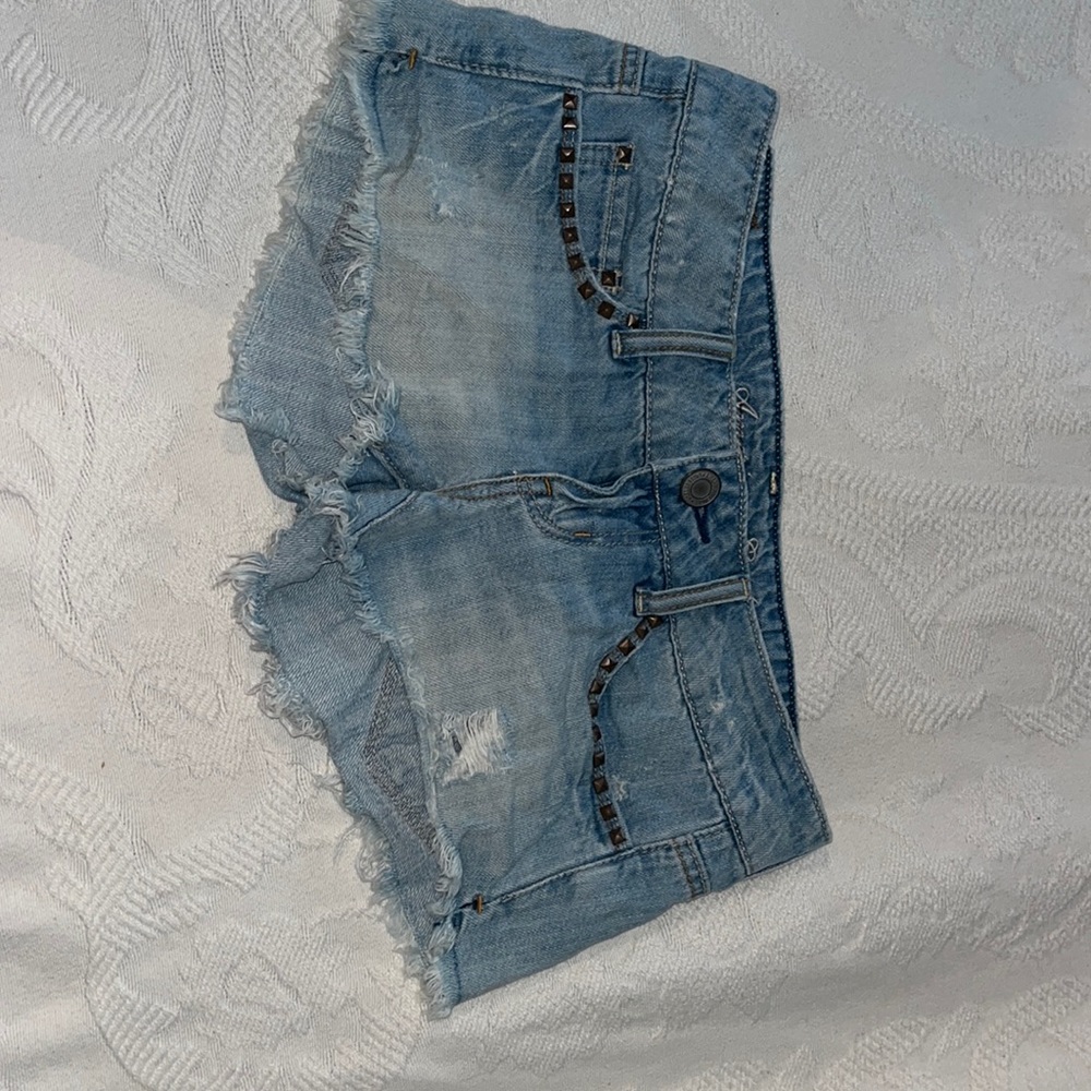American eagle jean shorts. Size 0. Vintage and light wash. With rips and studs.